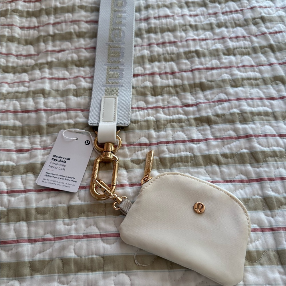Neverlost Lululemon keychain and Cream Pouch with Gold Details…vapor and gold
